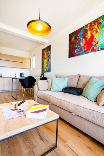 a living room with a couch and a table at VilaA21 in Bar