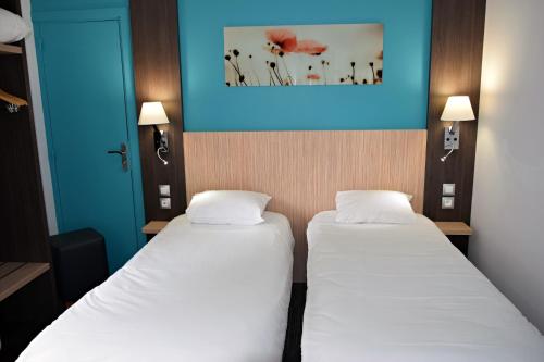 Postel nebo postele na pokoji v ubytování Contact Hotel Le Seino Marin - Cléon Elbeuf Rouen