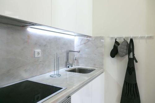 a kitchen with a sink and a counter top at TravelingToLisbon 314 - Restauradores in Lisbon