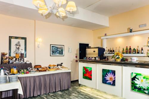 a room with a table with food on it at Hotel Viola in Gaeta