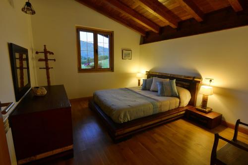 En eller flere senger på et rom på Casa Rural Amazonas