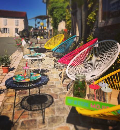 a group of tables and chairs on a patio at Maison & Tartine in Colombey-les-deux-Églises