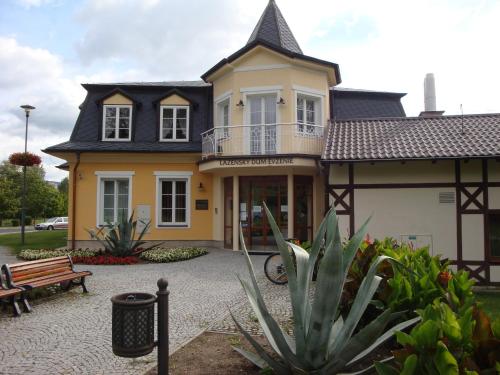 a house with a bench in front of it at Lázně Evženie in Klášterec nad Ohří