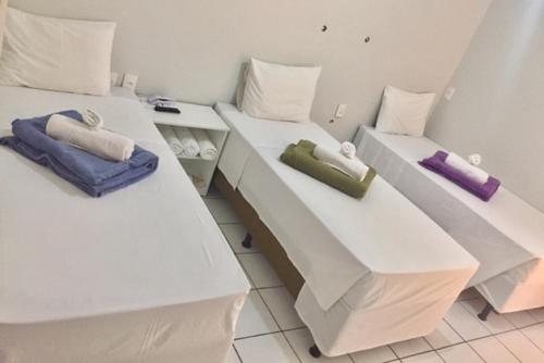 Ένα ή περισσότερα κρεβάτια σε δωμάτιο στο Acapu Hotel
