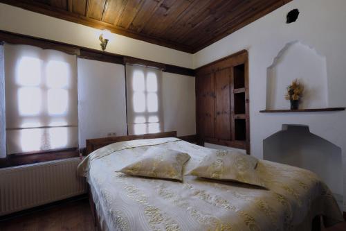 a bedroom with a bed with two pillows on it at Çamlıca Konak Çarsı in Safranbolu
