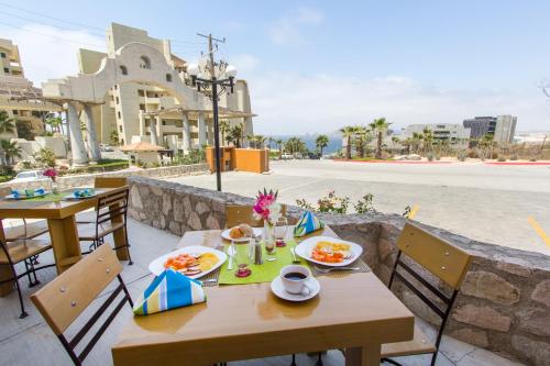 a table that has some food on it at Sunrock Condo Hotel in Cabo San Lucas