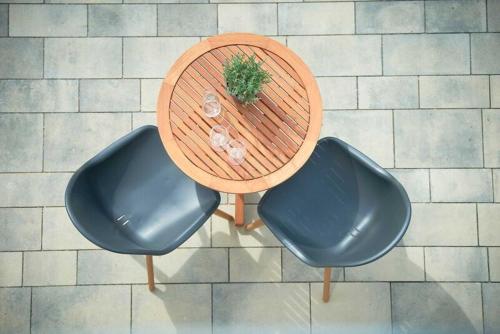 an overhead view of a table with two chairs and a plant at Villa Emma in Ostseebad Sellin