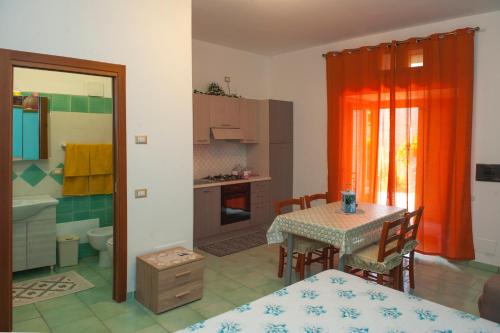 Ένα ή περισσότερα κρεβάτια σε δωμάτιο στο Case Vacanze Rossi
