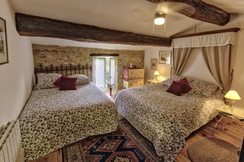 Cama ou camas em um quarto em Les Beaux Chenes