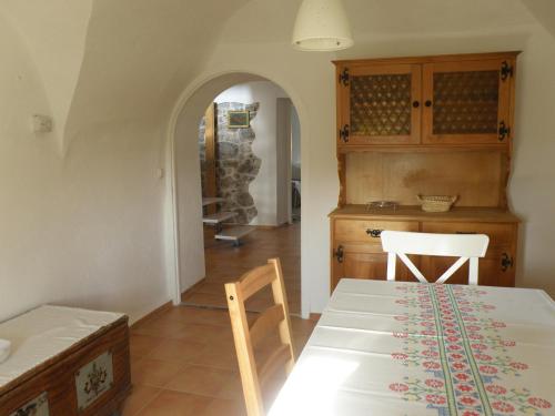 a kitchen with a table and chairs in a room at Idyllic place near Cerknica Lake in Cerknica