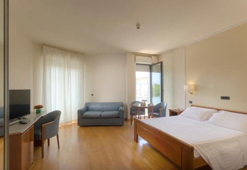 Postel nebo postele na pokoji v ubytování Hotel Il Timone