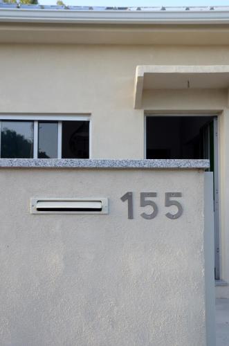 a house with a number on the side of it at Porto Smart Apartments- airport in Perafita