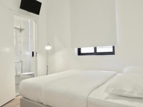 Cama o camas de una habitación en Porto Republica Riverside