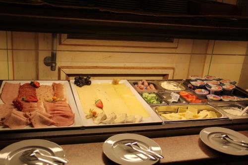 a buffet with different types of food on a table at Landhaus Sommerau in Buchenberg
