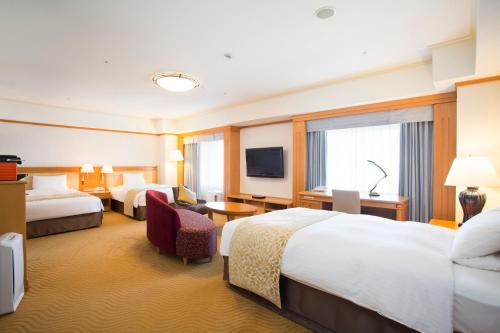 Rúm í herbergi á Hotel Nikko Kansai Airport - 3 mins walk to the airport