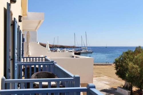 a view of the ocean from the balcony of a house at Xenonas Afroditi in Loutra