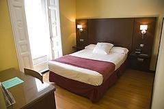 Cama o camas de una habitación en Hostal Astoria