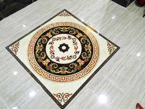 a table with a plate on it on a floor at Victoria Inn in Hong Kong