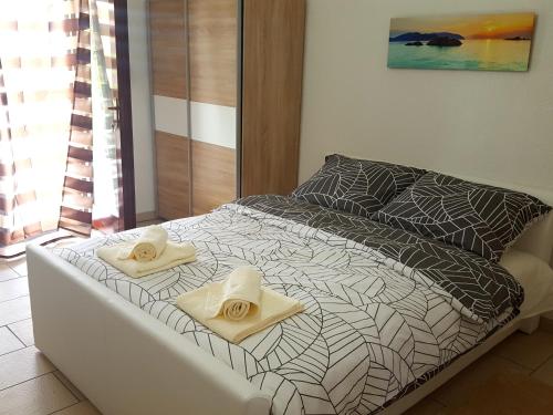 Postel nebo postele na pokoji v ubytování Apartments Merion
