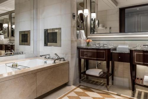 a large bathroom with a tub and a sink at Four Seasons Hotel Macao, Cotai Strip in Macau