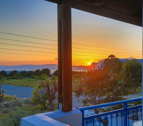 a view of the sunset from the porch of a house at Villa Amor in Pefki Rhodes
