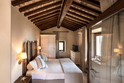 Postel nebo postele na pokoji v ubytování Agriturismo Galenzana