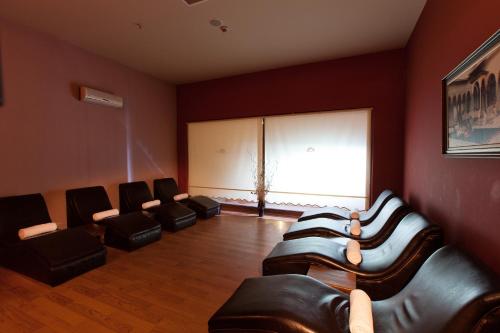 a waiting room with leather chairs and a large window at Adalya Art Side - Ultra All Inclusive in Side