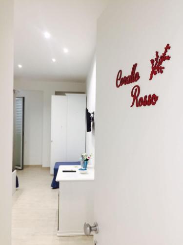 a hospital room with a bed and a sign on a wall at B&b VICTORIA in Porto Cesareo
