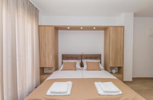 Ένα ή περισσότερα κρεβάτια σε δωμάτιο στο Villa Astoria