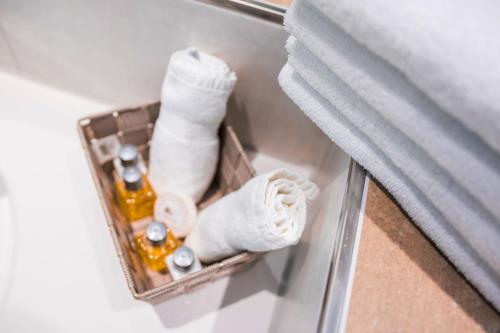 a box with towels and a bottle of soap and a window at Ferienwohnung Burgblick in Bullay