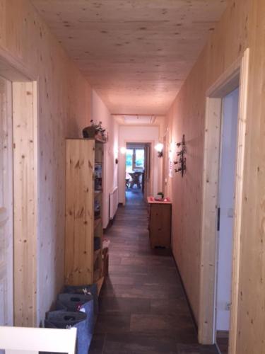 a hallway of a building with a hallwayngth at Bergpension-Ebental in Brixen im Thale