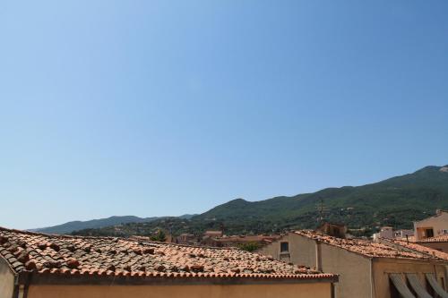 a view of a town with mountains in the background at Hotel Paradiso Delle Madonie in Castelbuono