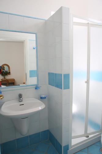 a bathroom with a sink and a shower at Affittacamere Via Muraglione in Ventotene