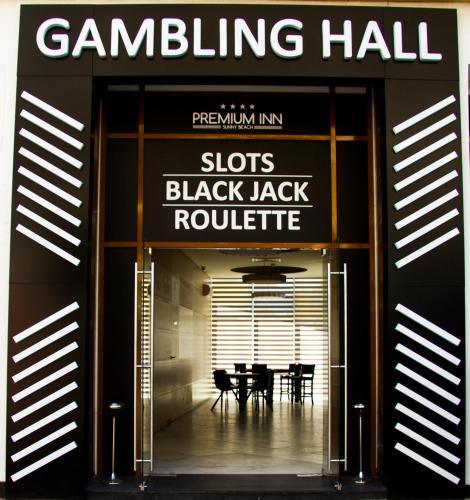 a building with a sign that reads slots black jack roubeit at Best Western PLUS Premium Inn in Sunny Beach