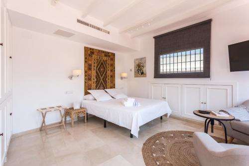 A bed or beds in a room at Lujo en el corazon de Sevilla