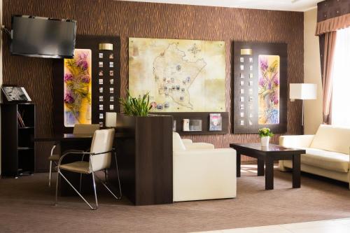 a living room with a couch and a table at Portius in Krosno