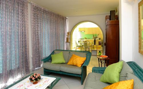 a living room with two chairs and a couch at Amalfi Coast Houses in Atrani
