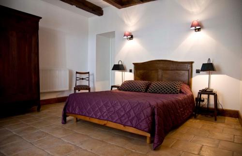 Tempat tidur dalam kamar di Hotel des Consuls