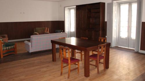 a living room filled with furniture and a table at BE Coimbra Hostels in Coimbra