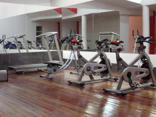 a row of exercise bikes in a gym at Hotel Villa Antigua in Sucre