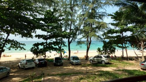 a group of cars parked at the beach at Naithon condominium A-103 in Nai Thon Beach