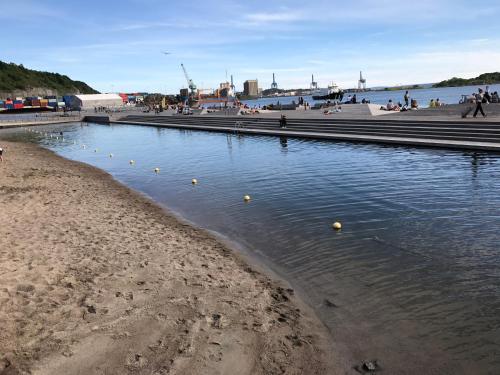 a beach with yellow balls in the water at City Center Oslo- Venice Apartment Sea Side Three-Bedrooms and Two Toilettes in Oslo