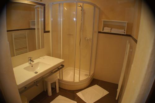 a bathroom with a shower and a sink at Hotel Sonneck in Schladming