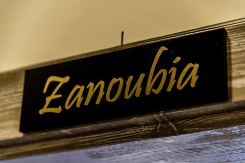 a sign that reads lenoxia sitting on a table at Asamina Boutique Hotel in Soûr