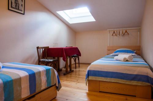 Ένα ή περισσότερα κρεβάτια σε δωμάτιο στο Guest House Lile