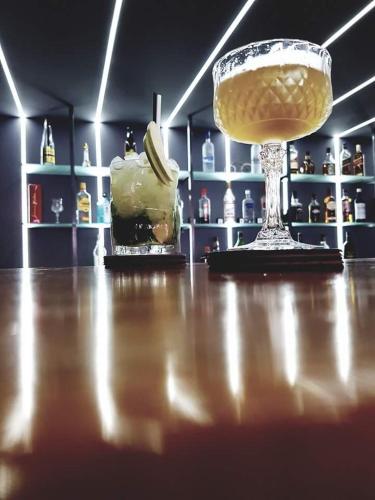 a room with a counter with a drink and a bowl of banana at Kochylari Apartments in Kefalos