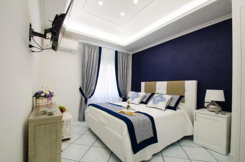 Un pat sau paturi într-o cameră la B&B Maiori Luxury