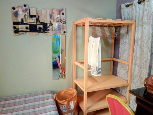 a room with a bunk bed with a shelf at Feehi's Place in Accra