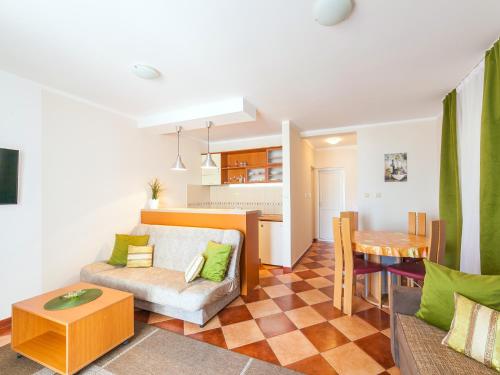 a living room with a couch and a table at Apartments Spin in Budva