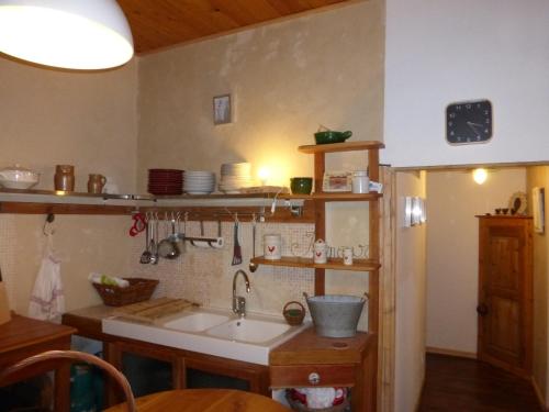 a kitchen with a sink and a counter at MOULIN 2 in Barcelonnette